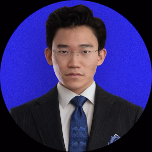 Portrait of Will Chai wearing a dark suit